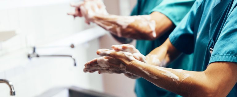 Surgeons washing hands - hand hygiene - healthcare