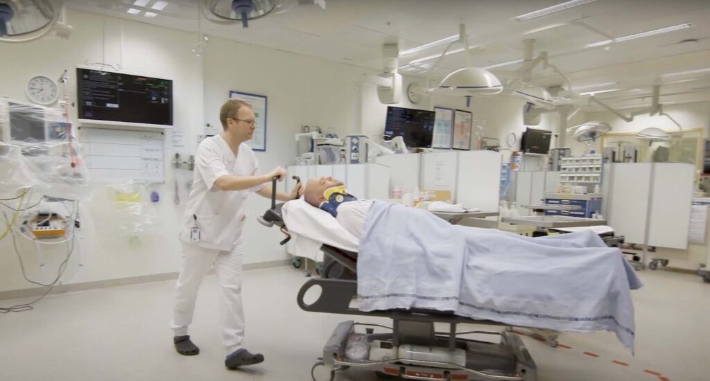 Healthcare practitioner tending to patient.